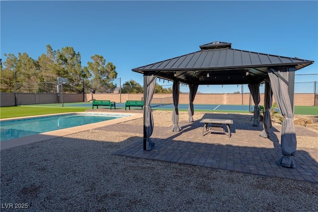 view of pool featuring a gazebo and fence