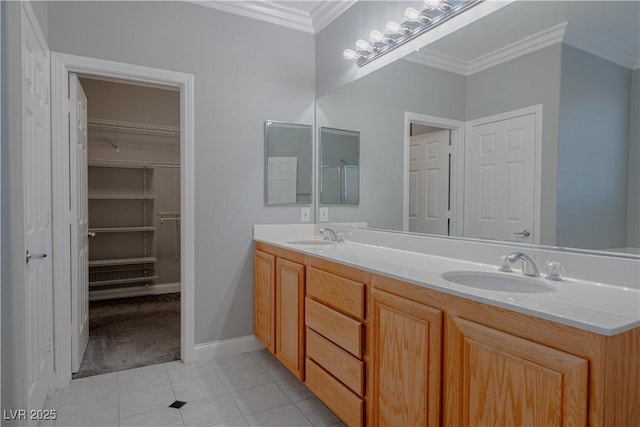 8228 Fulton Ranch St, Las Vegas, NV 89131 - bathroom featuring ornamental molding, double vanity, tile patterned floors, and a spacious closet