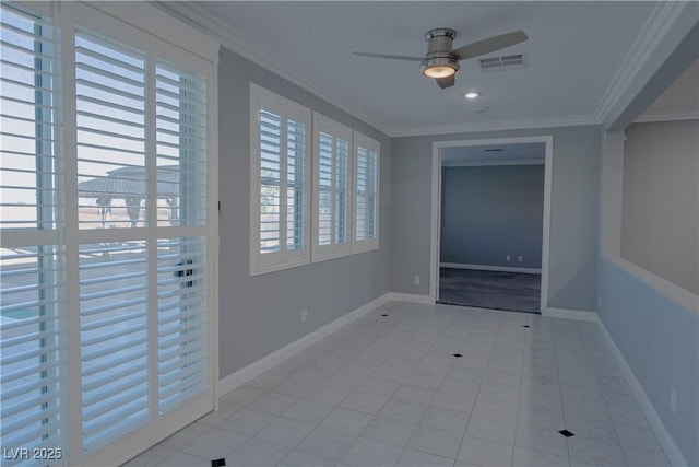 tiled spare room with a ceiling fan, plenty of natural light, crown molding, baseboards, and recessed lighting
