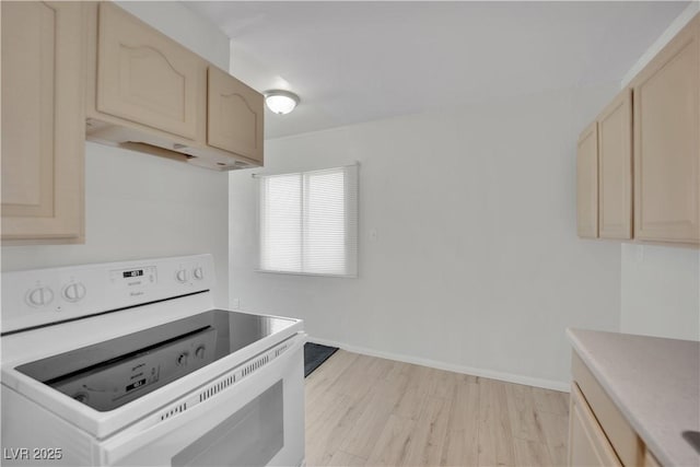 2016 Linden Ave, Las Vegas, NV 89101 - kitchen with electric range, light brown cabinets, light countertops, and light wood-style flooring