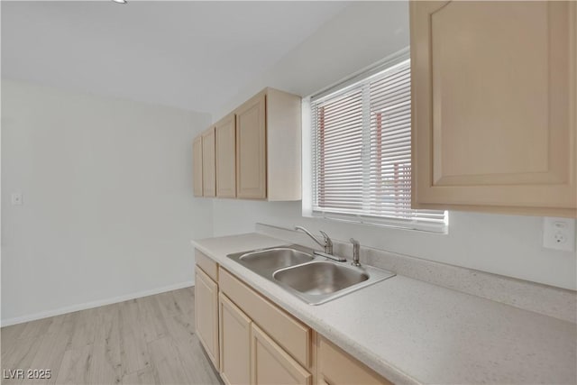 2016 Linden Ave, Las Vegas, NV 89101 - kitchen featuring a sink, light brown cabinets, light countertops, and baseboards