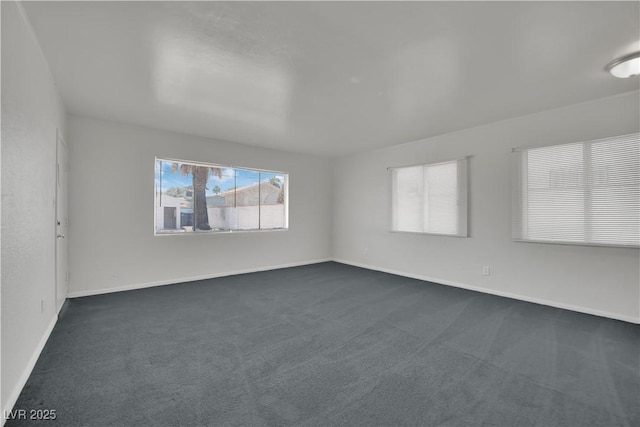 2016 Linden Ave, Las Vegas, NV 89101 - spare room featuring dark carpet and baseboards