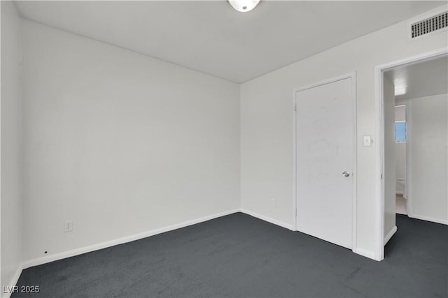 2016 Linden Ave, Las Vegas, NV 89101 - unfurnished room with dark carpet and baseboards
