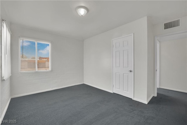 2016 Linden Ave, Las Vegas, NV 89101 - unfurnished bedroom with dark carpet and baseboards