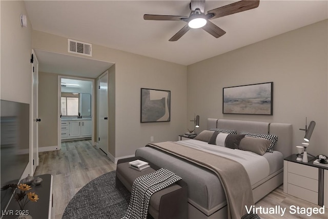 bedroom featuring light wood finished floors, baseboards, and a ceiling fan