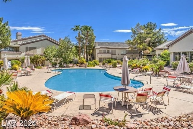 community pool with a patio