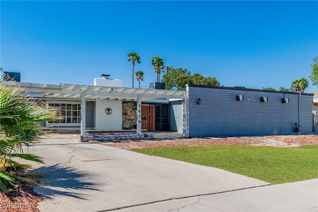 1679 Raindance Way, Las Vegas, NV 89169 - view of front of house with a pergola and a chimney