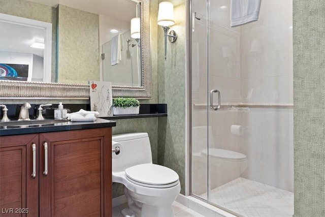 125 E Harmon Ave Unit 321, Las Vegas, NV 89109 - full bath with a stall shower, toilet, and vanity