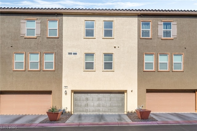 4650 Ranch House Rd Unit 86, North Las Vegas, NV 89031 - view of building exterior featuring a garage