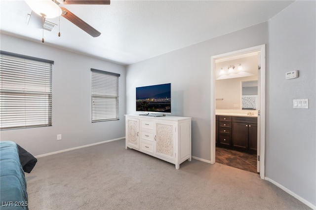 4650 Ranch House Rd Unit 86, North Las Vegas, NV 89031 - bedroom with light colored carpet, ensuite bathroom, baseboards, and ceiling fan