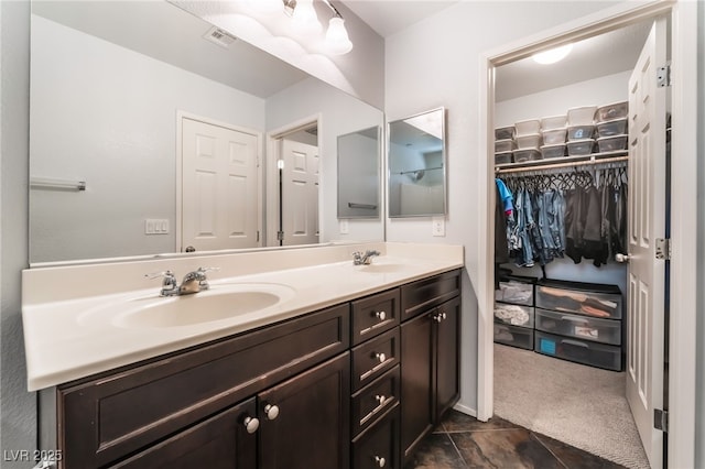4650 Ranch House Rd Unit 86, North Las Vegas, NV 89031 - bathroom with double vanity and a walk in closet