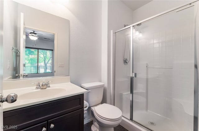 4650 Ranch House Rd Unit 86, North Las Vegas, NV 89031 - bathroom with a stall shower, toilet, vanity, and a ceiling fan