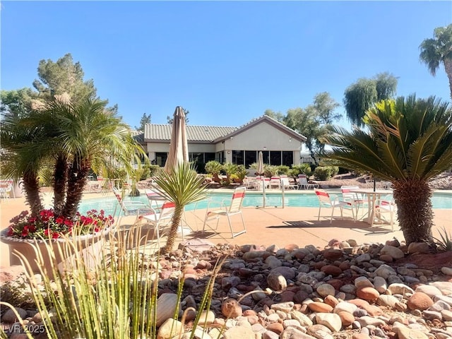 community pool featuring a patio area