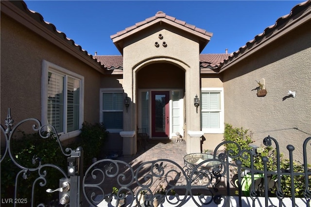 7325 Rustic Crest St, Las Vegas, NV 89149 - doorway to property with a tiled roof and stucco siding