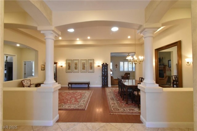 7325 Rustic Crest St, Las Vegas, NV 89149 - living area featuring ornate columns, recessed lighting, wood finished floors, arched walkways, and a chandelier