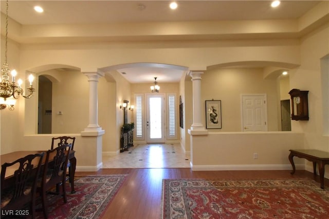 7325 Rustic Crest St, Las Vegas, NV 89149 - foyer entrance featuring wood finished floors, arched walkways, recessed lighting, a chandelier, and baseboards
