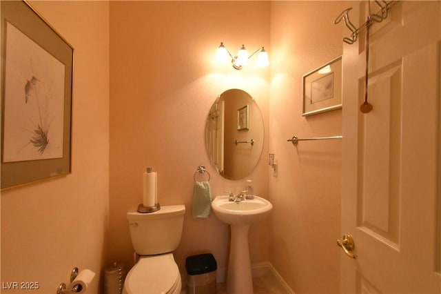 7325 Rustic Crest St, Las Vegas, NV 89149 - bathroom with toilet, a sink, and tile patterned floors