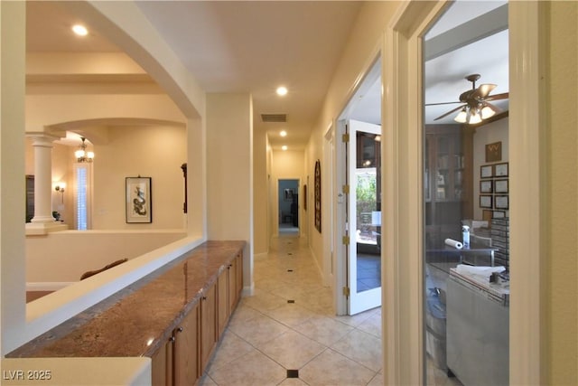 7325 Rustic Crest St, Las Vegas, NV 89149 - hallway featuring arched walkways and light tile patterned flooring