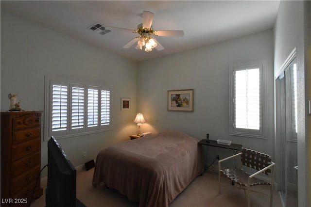 7325 Rustic Crest St, Las Vegas, NV 89149 - bedroom featuring multiple windows, carpet flooring, ceiling fan, and baseboards