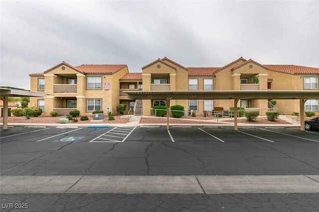 2300 E Silverado Ranch Blvd Unit 1070, Las Vegas, NV 89183 - view of building exterior with covered and uncovered parking