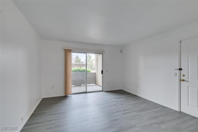 2300 E Silverado Ranch Blvd Unit 1070, Las Vegas, NV 89183 - empty room with wood finished floors and baseboards