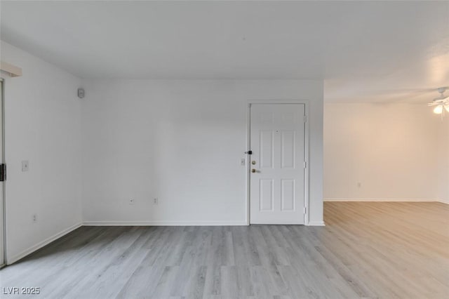 2300 E Silverado Ranch Blvd Unit 1070, Las Vegas, NV 89183 - spare room featuring light wood finished floors, ceiling fan, and baseboards