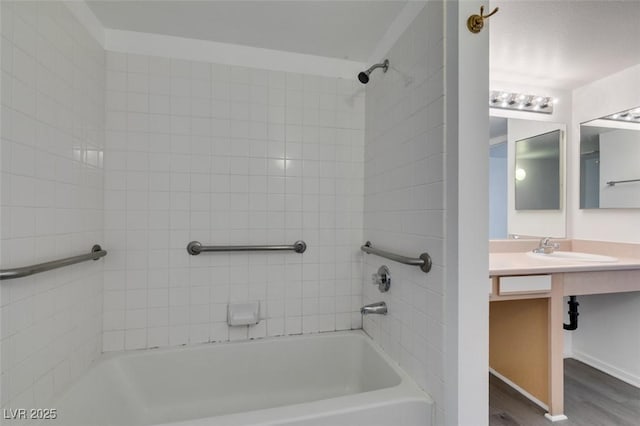 2300 E Silverado Ranch Blvd Unit 1070, Las Vegas, NV 89183 - full bathroom featuring washtub / shower combination, wood finished floors, and vanity