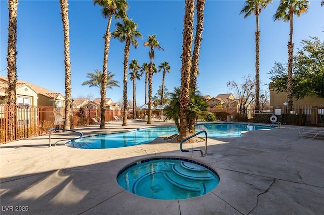 2300 E Silverado Ranch Blvd Unit 1070, Las Vegas, NV 89183 - community pool featuring a hot tub, a patio area, and fence