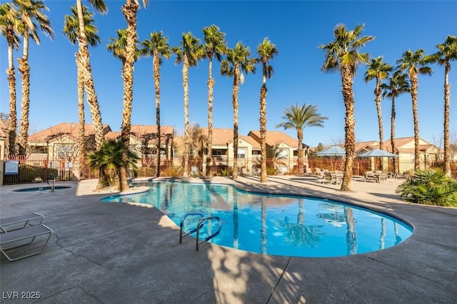 2300 E Silverado Ranch Blvd Unit 1070, Las Vegas, NV 89183 - community pool featuring a patio, a residential view, and fence