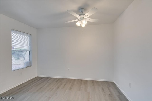 2300 E Silverado Ranch Blvd Unit 1070, Las Vegas, NV 89183 - unfurnished room with light wood finished floors, ceiling fan, and baseboards