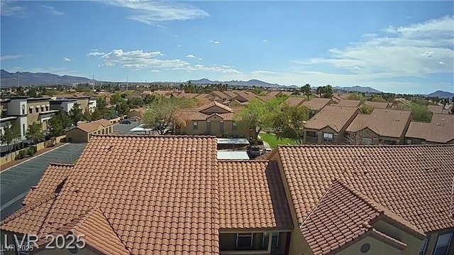 2300 E Silverado Ranch Blvd Unit 1070, Las Vegas, NV 89183 - exterior view of a tiled roof, a residential view, and a mountain view