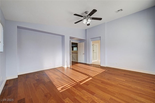 unfurnished bedroom with wood finished floors, baseboards, and a ceiling fan