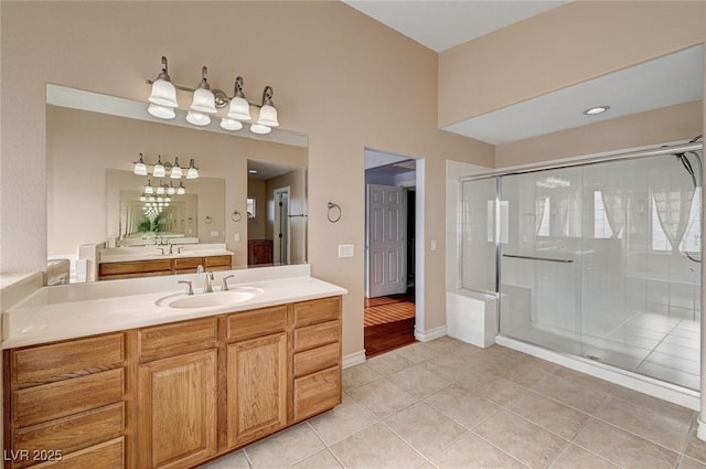 bathroom featuring a shower stall, vanity, and tile patterned flooring