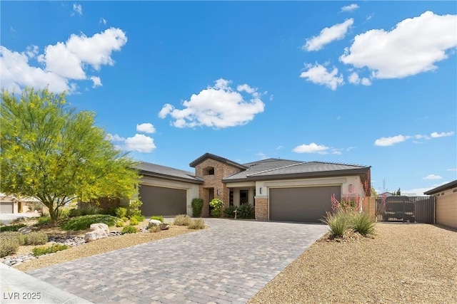 7477 Triple Knot Ct, Las Vegas, NV 89113 - view of front of house with a garage, a gate, and decorative driveway