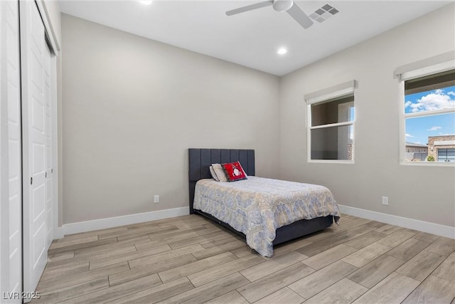 7477 Triple Knot Ct, Las Vegas, NV 89113 - bedroom with wood finished floors, baseboards, recessed lighting, ceiling fan, and a closet
