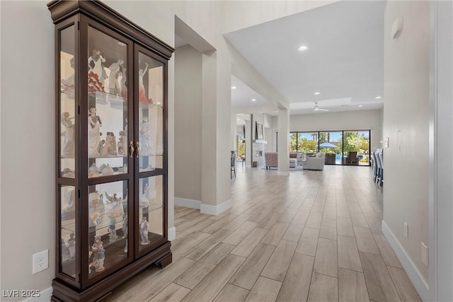 7477 Triple Knot Ct, Las Vegas, NV 89113 - hall featuring light wood-style flooring, baseboards, and recessed lighting