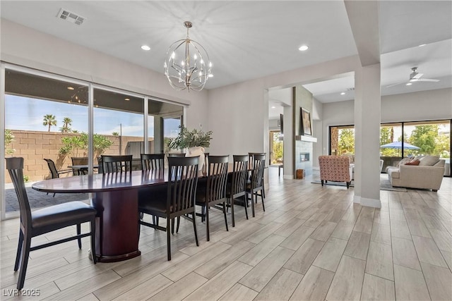 7477 Triple Knot Ct, Las Vegas, NV 89113 - dining area with light wood-style floors, a chandelier, recessed lighting, and ceiling fan