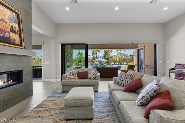 7477 Triple Knot Ct, Las Vegas, NV 89113 - living area with recessed lighting, wood finished floors, a fireplace, and baseboards