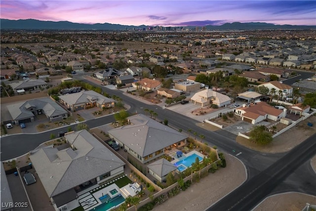 7477 Triple Knot Ct, Las Vegas, NV 89113 - aerial view at dusk of a mountain view, view of pool, and a residential view