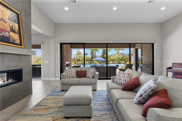 7477 Triple Knot Ct, Las Vegas, NV 89113 - living area featuring wood finished floors, recessed lighting, a fireplace, and baseboards