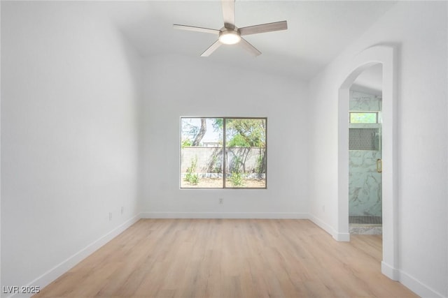 unfurnished room with light wood-style flooring, baseboards, and a ceiling fan