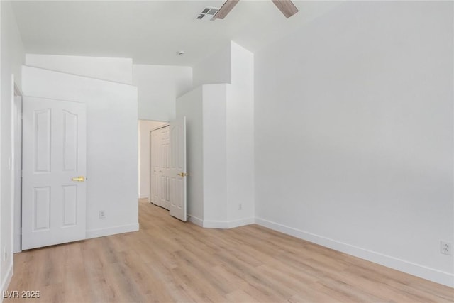 unfurnished bedroom featuring light wood-style flooring, baseboards, and ceiling fan