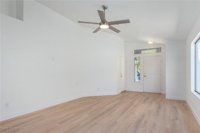 entrance foyer with lofted ceiling, light wood-style floors, ceiling fan, and baseboards