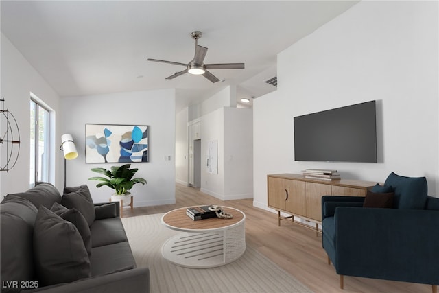 living area with ceiling fan, light wood-type flooring, lofted ceiling, and baseboards