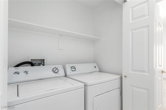 laundry area with independent washer and dryer