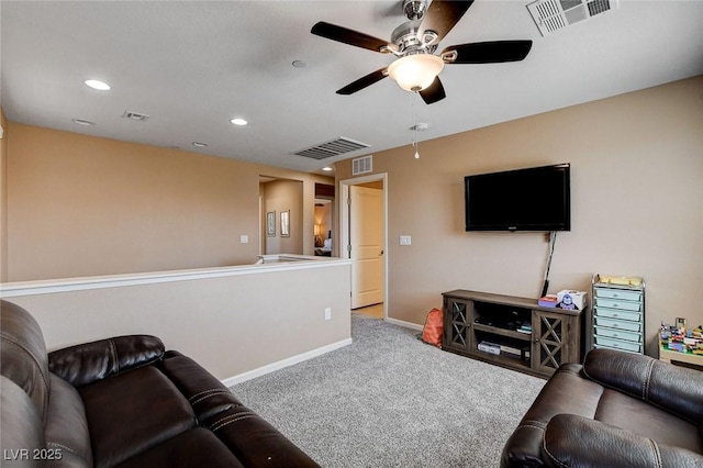 carpeted living room featuring ceiling fan, baseboards, and recessed lighting