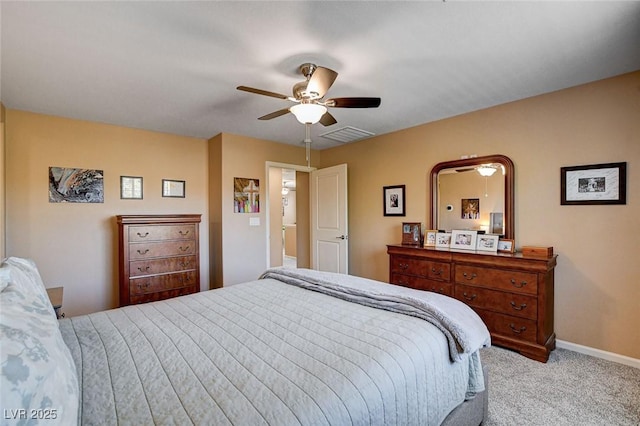 carpeted bedroom with baseboards and ceiling fan