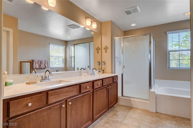 full bathroom with a garden tub, tile patterned floors, a stall shower, and double vanity