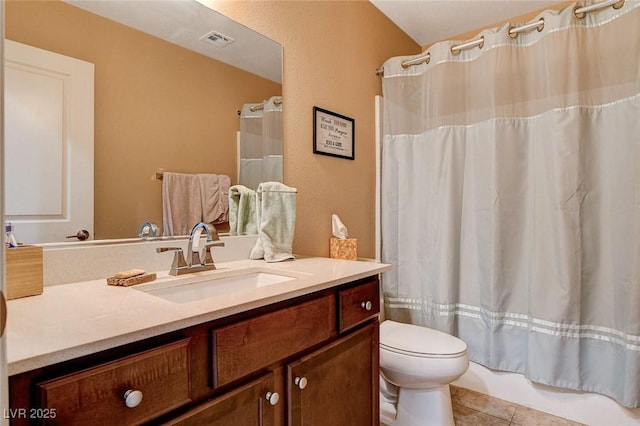 full bathroom with tile patterned flooring, vanity, and toilet