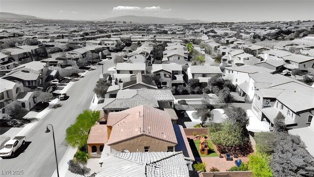aerial view of residential area with mountains